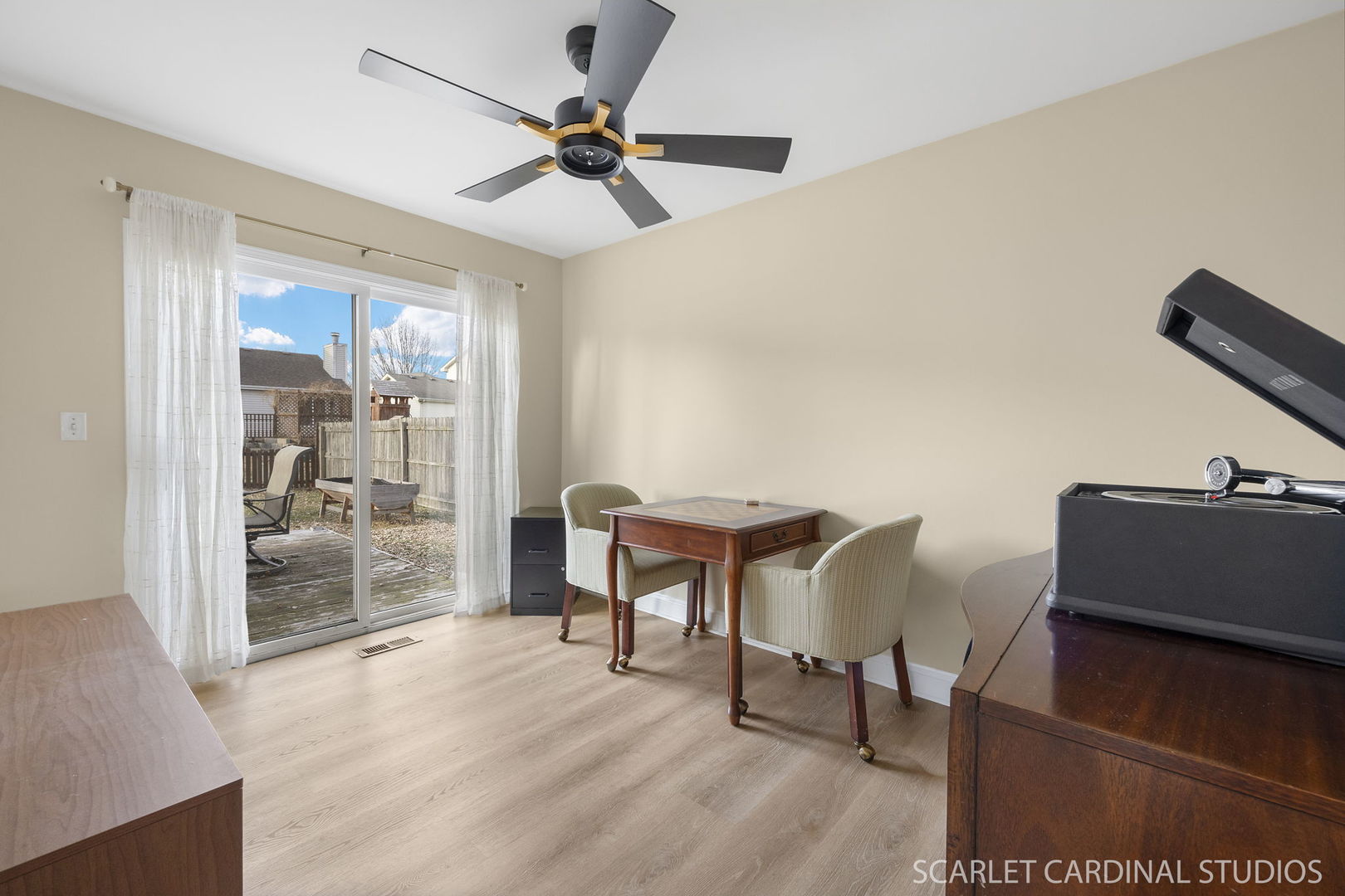 2828 Bluewater Circle Naperville, IL 60564 - Photo 10 of 17 a view of a livingroom with furniture and a ceiling fan