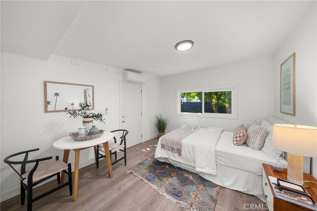 a bedroom with a bed and a table