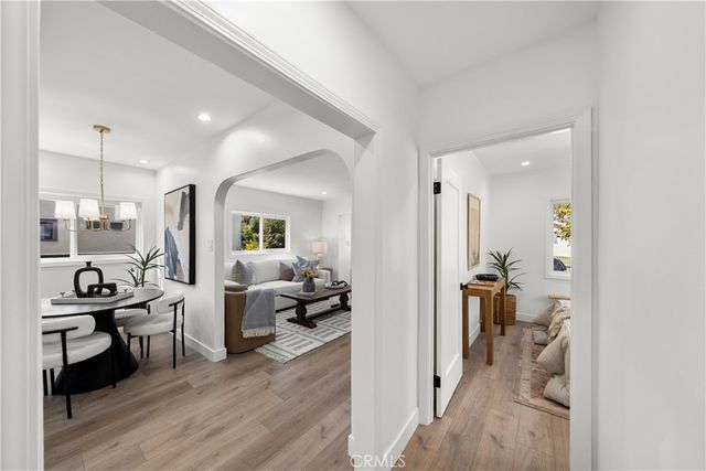 a view of a livingroom with furniture and hardwood floor
