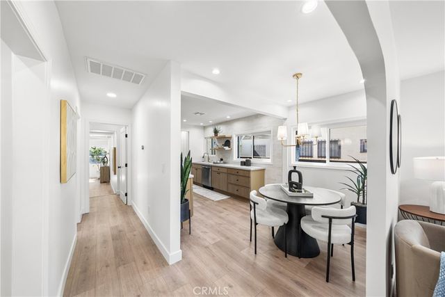 a view of a living room and kitchen