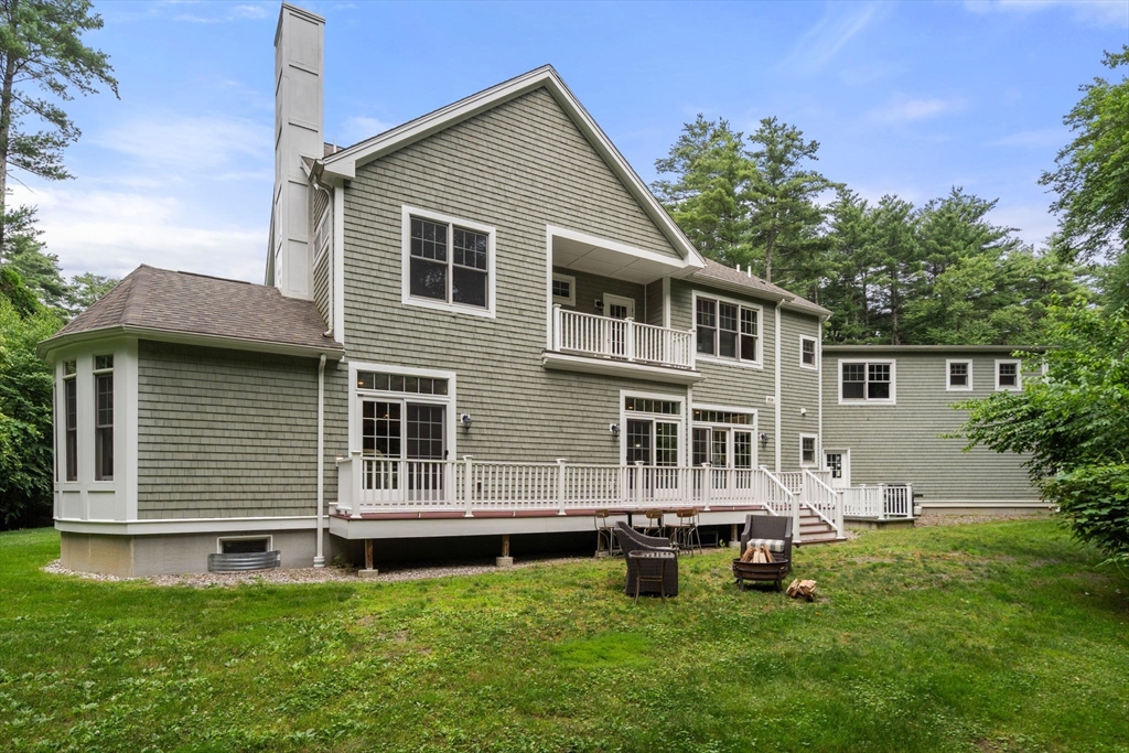 24 Wayside Inn Road Framingham, MA 01701 - Photo 6 of 38 a front view of a house with a garden and trees