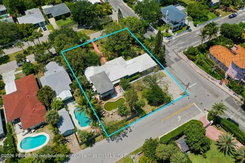 an aerial view of house with a yard