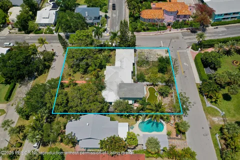 an aerial view of multiple houses with yard