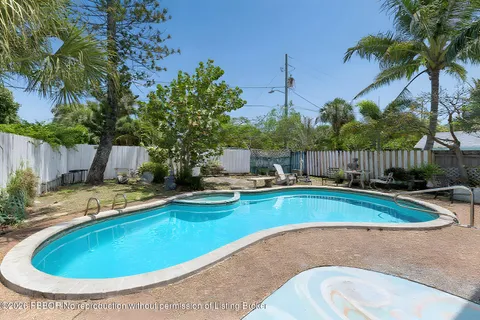 a view of a swimming pool with a lounge chairs