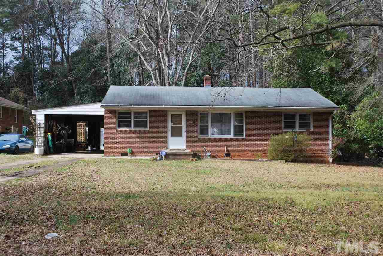 111 Weston Road Garner, NC 27529 - Photo 2 of 10 a front view of a house with a garden and trees