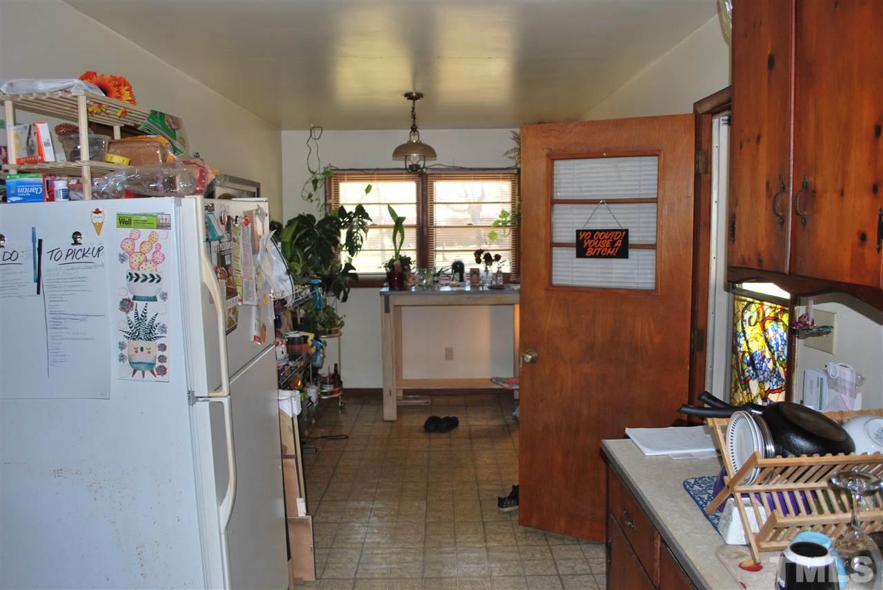 111 Weston Road Garner, NC 27529 - Photo 5 of 10 a dining room with furniture and a chandelier