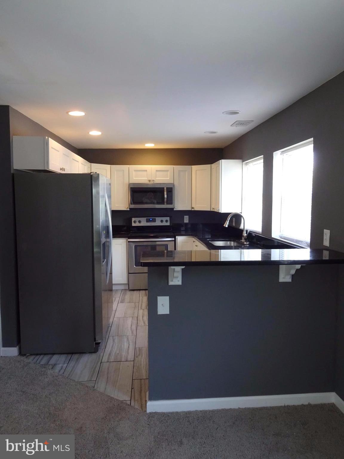 11 Torque Way Baltimore, MD 21220 - Photo 12 of 20 Kitchen Breakfast Bar