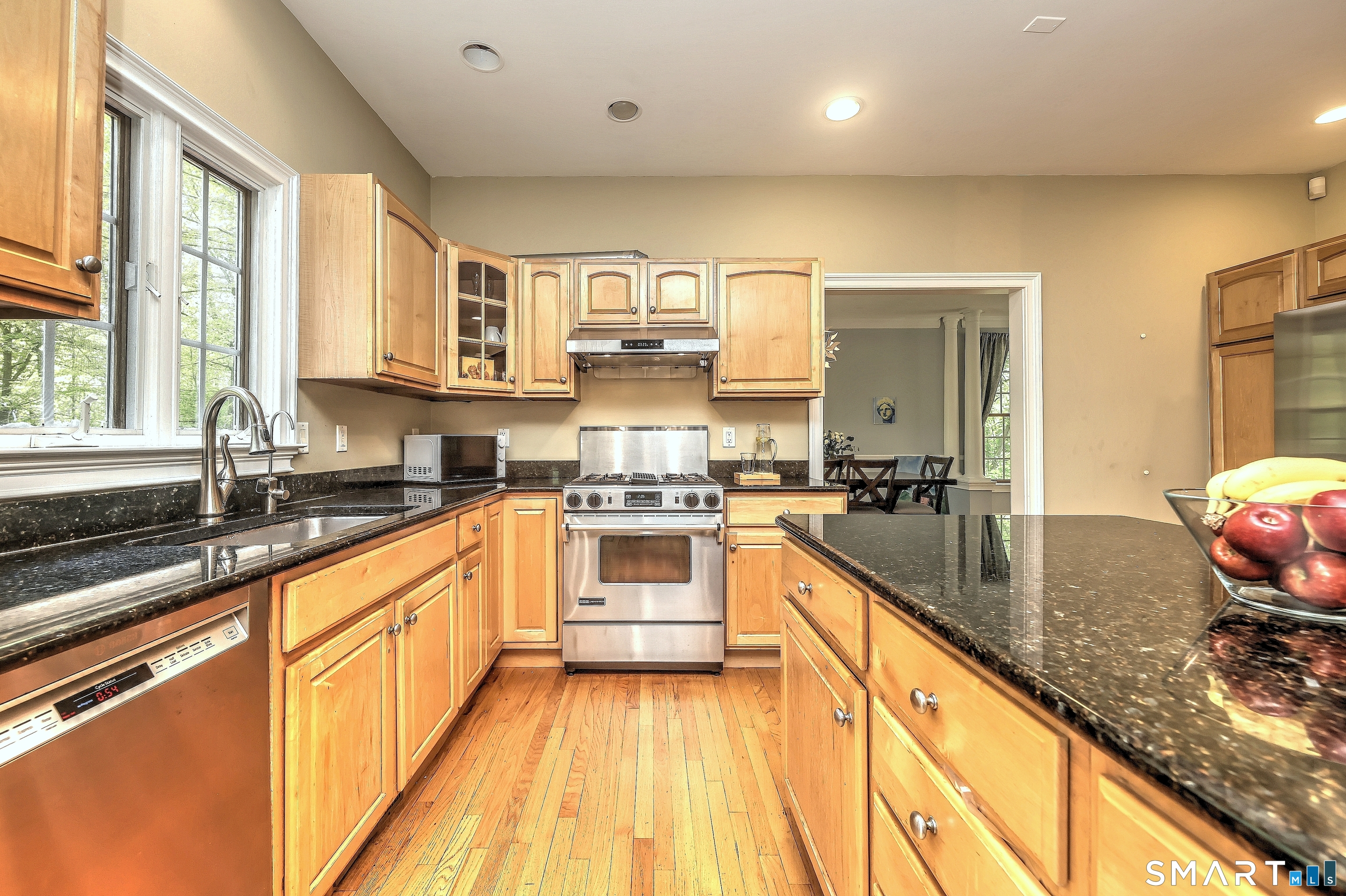 125 Peck Hill Road Woodbridge, CT 06525 - Photo 10 of 40 a large kitchen with stainless steel appliances granite countertop a sink and cabinets