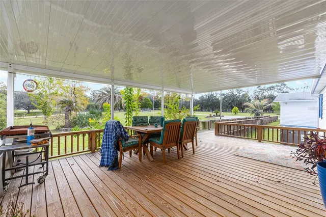 swimming pool view with a seating space