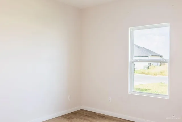 a view of an empty room and window