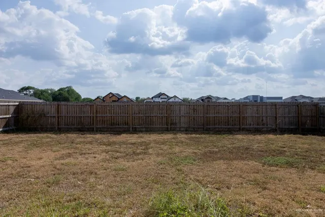 a view of outdoor space with wooden fence