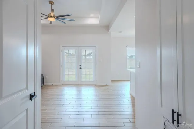 wooden floor in an empty room with a mirror