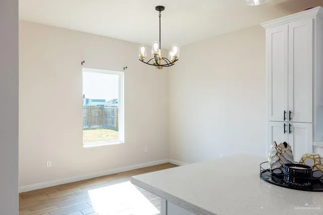 a view of a room with a window and ceiling fan