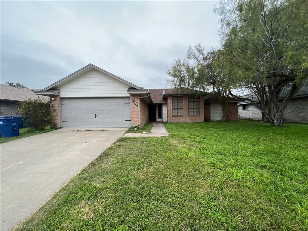 7309 Ridge Creek Drive Corpus Christi, TX 78413 - Photo 1 of 6 a front view of house with yard and green space