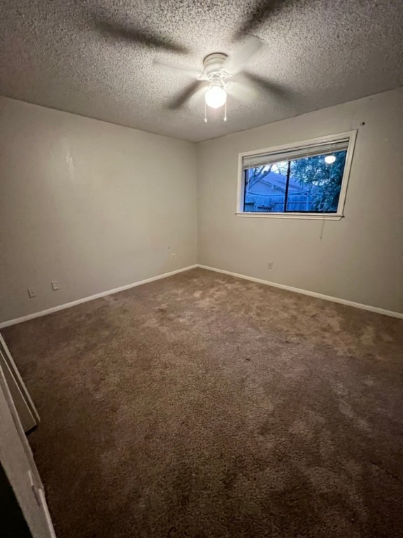 7309 Ridge Creek Drive Corpus Christi, TX 78413 - Photo 4 of 6 an empty room with a ceiling fan and window