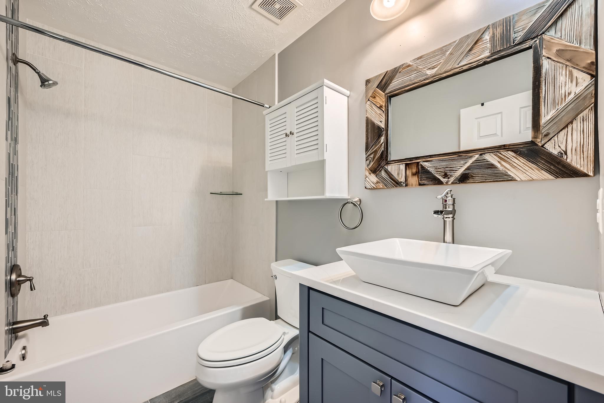 9655 Davison Road Middle River, MD 21220 - Photo 28 of 43 a bathroom with a sink a toilet and shower