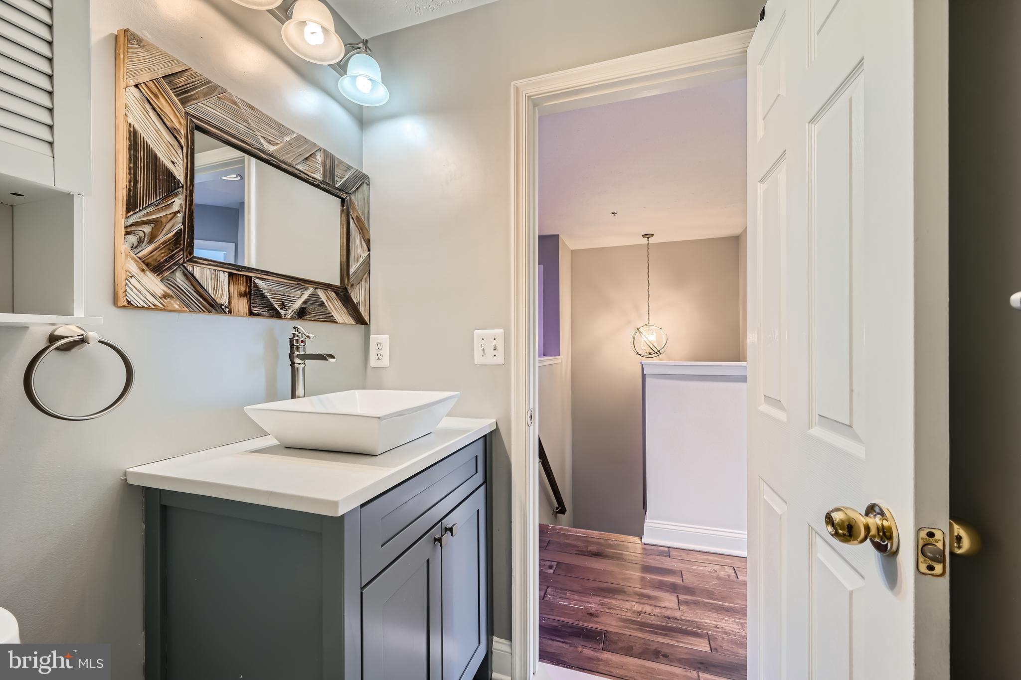 9655 Davison Road Middle River, MD 21220 - Photo 29 of 43 a bathroom with a sink and a mirror