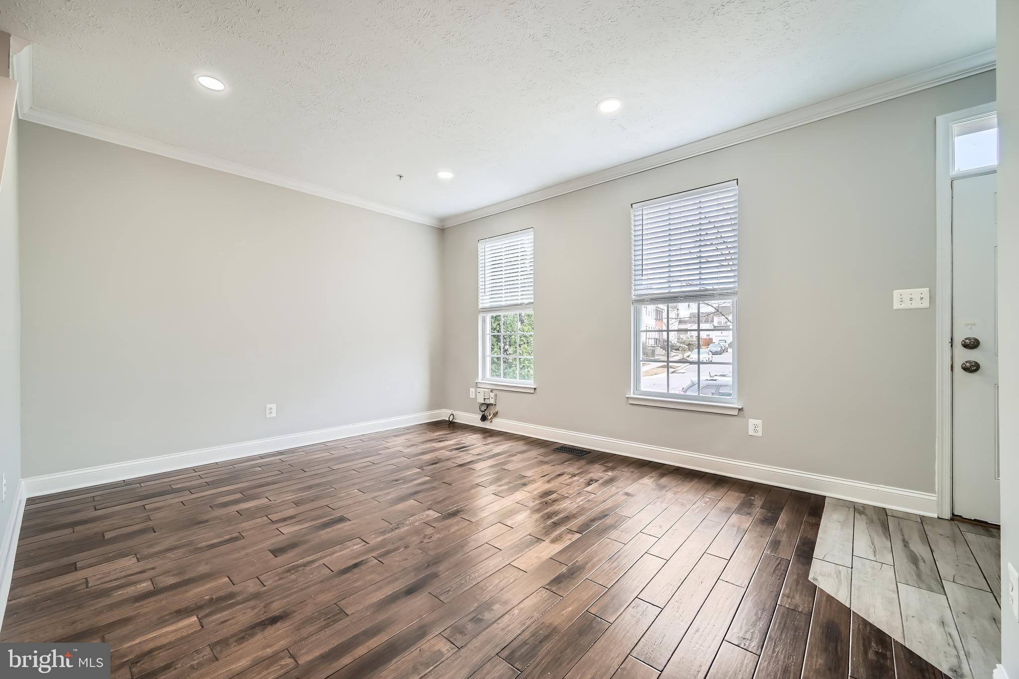 9655 Davison Road Middle River, MD 21220 - Photo 5 of 43 a view of an empty room with wooden floor and a window