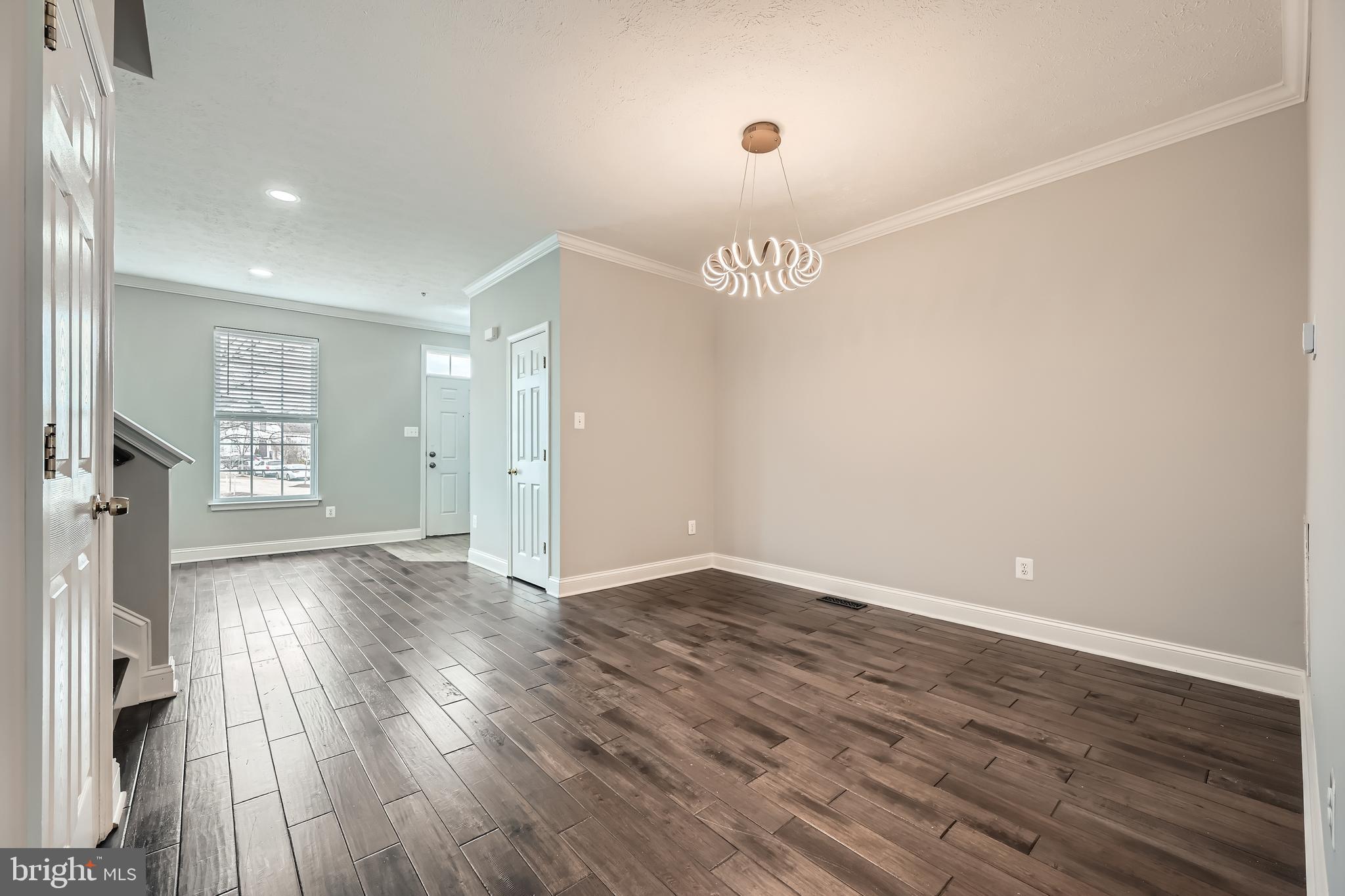 9655 Davison Road Middle River, MD 21220 - Photo 6 of 43 an empty room with wooden floor and windows