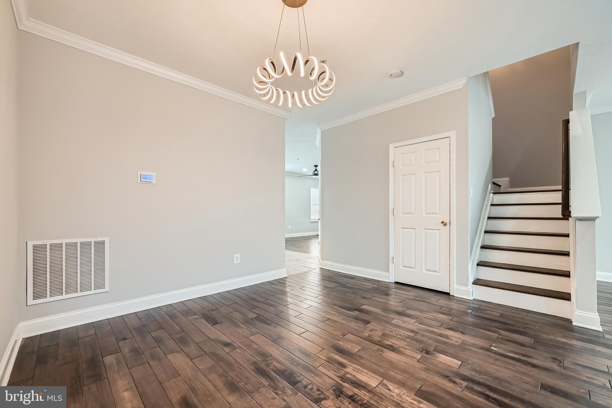 9655 Davison Road Middle River, MD 21220 - Photo 8 of 43 a view of a hallway with entryway wooden floor and front door