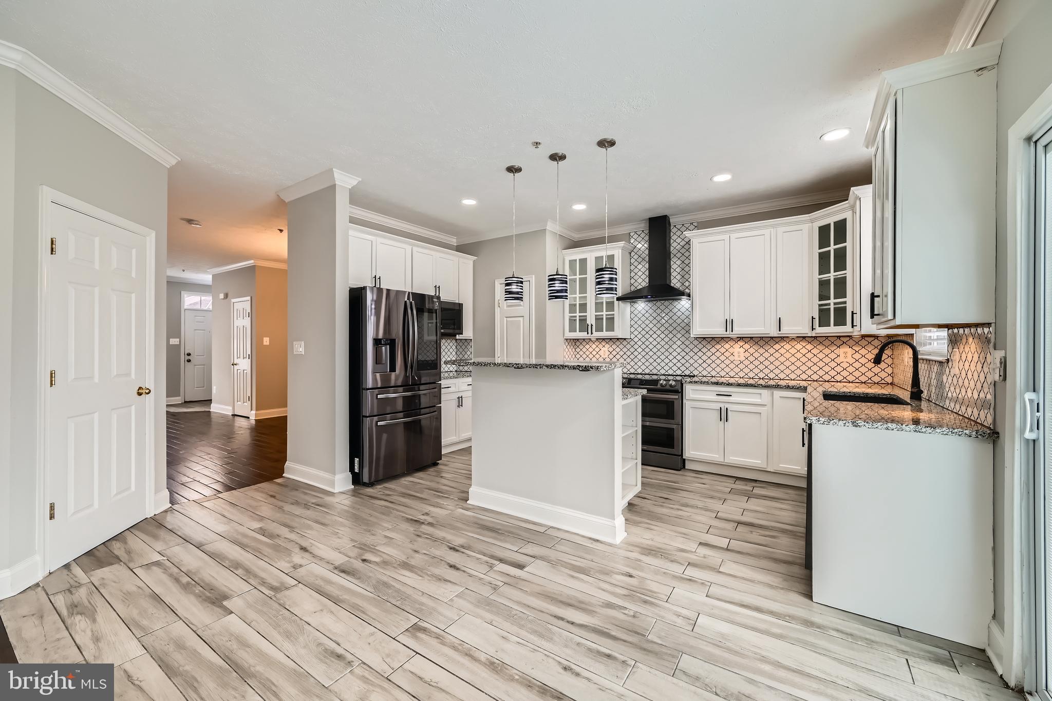 9655 Davison Road Middle River, MD 21220 - Photo 10 of 43 a kitchen with a refrigerator and a sink