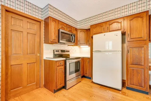 a bathroom with a shower and a toilet