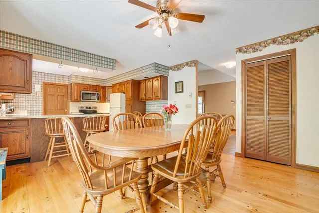 a bedroom with bed and a chandelier