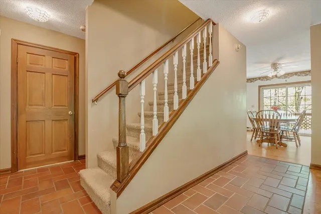 a view of a chair and table in the balcony