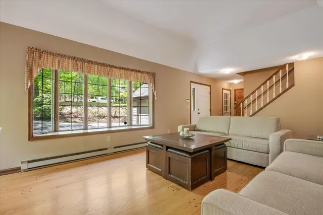 a living room with furniture and a large window