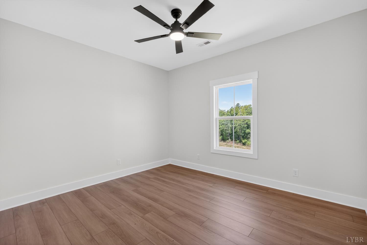 20 Fox Hall Drive Amherst, VA 24521 - Photo 31 of 46 an empty room with wooden floor and windows