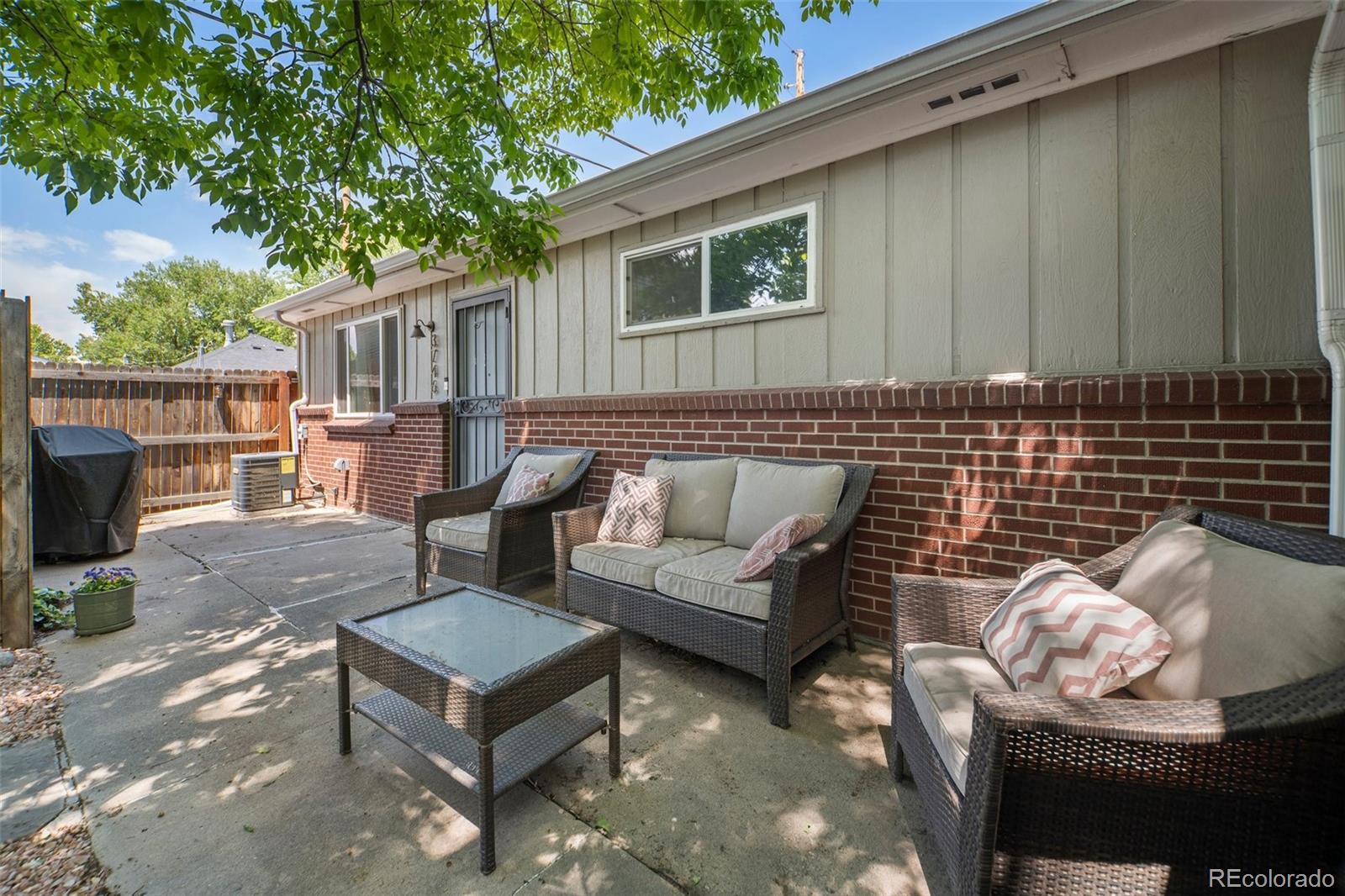 3746 Yates Street Denver, CO 80212 - Photo 20 of 21 a outdoor living space with furniture and a fireplace
