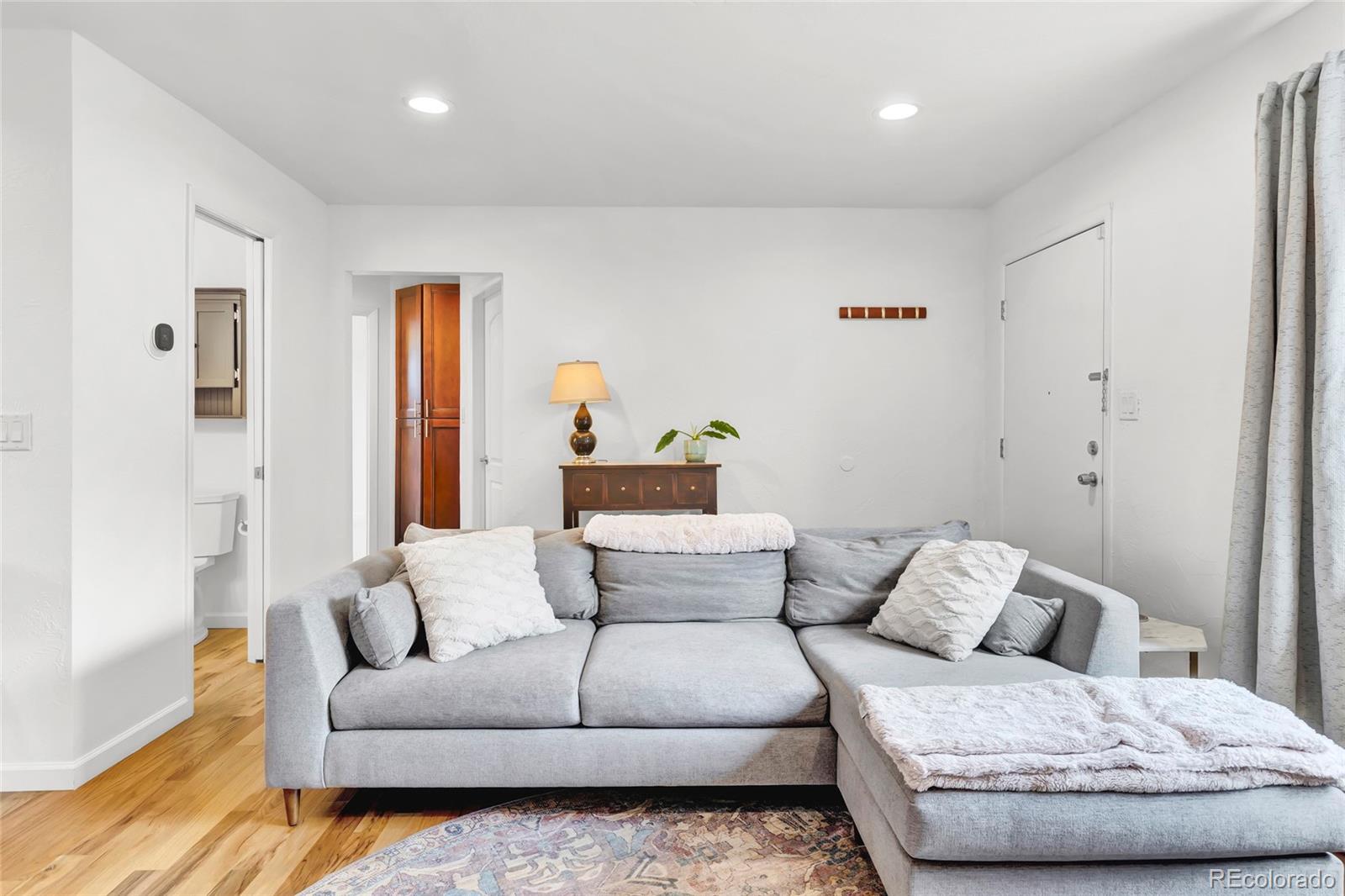 3746 Yates Street Denver, CO 80212 - Photo 2 of 21 a living room with furniture and a couch