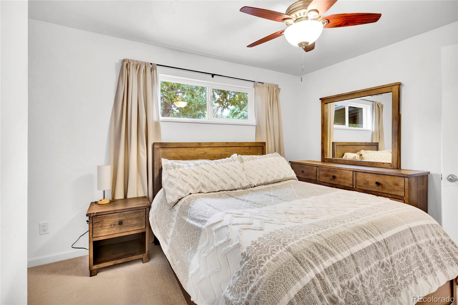 3746 Yates Street Denver, CO 80212 - Photo 10 of 21 a bedroom with a bed and a window