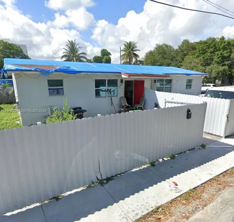front view of a house with a bench