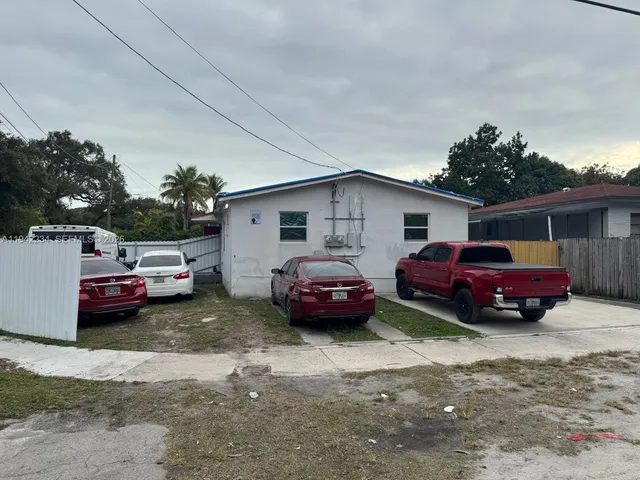a car parked in front of a house