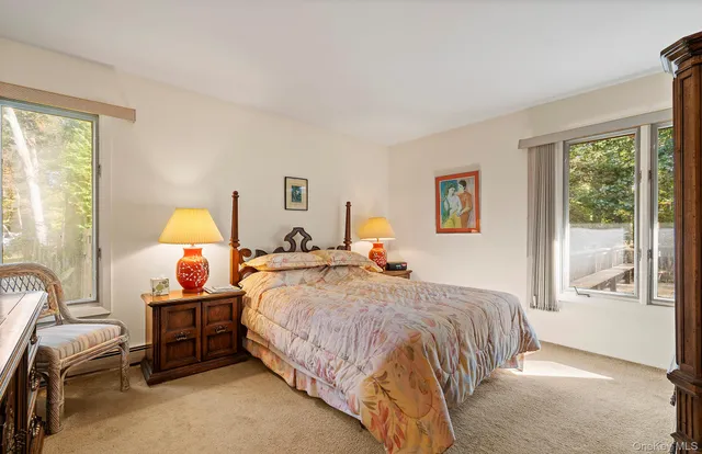 a bedroom with bed and a window