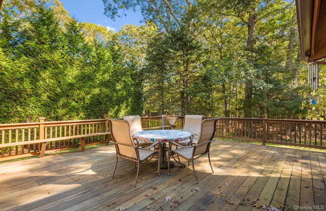 a view of a chairs and table on the wooden floor