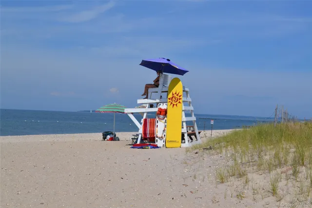 a view of a patio with chairs and a table