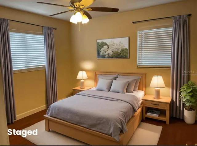 a bedroom with a bed and a window