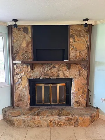 a living room with a fireplace and a fireplace