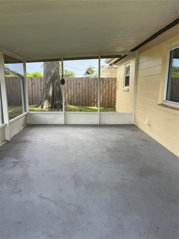 a view of an empty room with a balcony