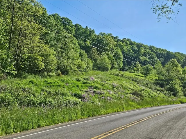 a picture of a room with a white wall and a picture of a bathroom