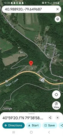 a view of a field with an ocean