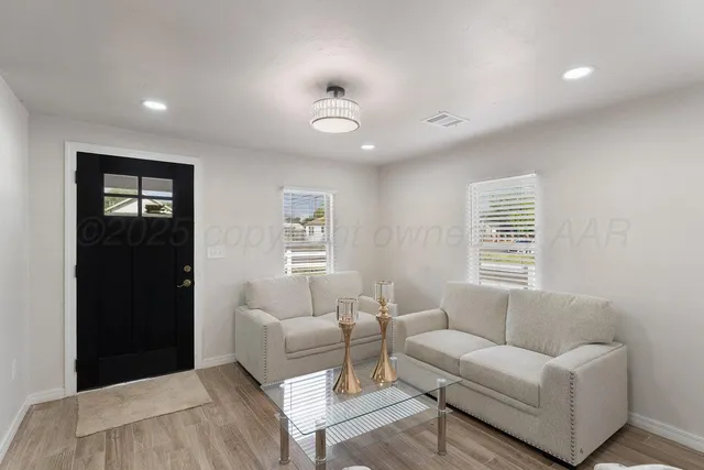 a living room with furniture and a window