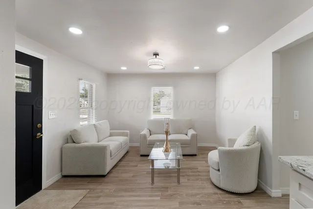 a living room with furniture and a window