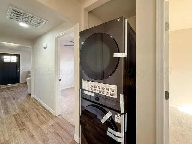 a view of hallway with wooden floor
