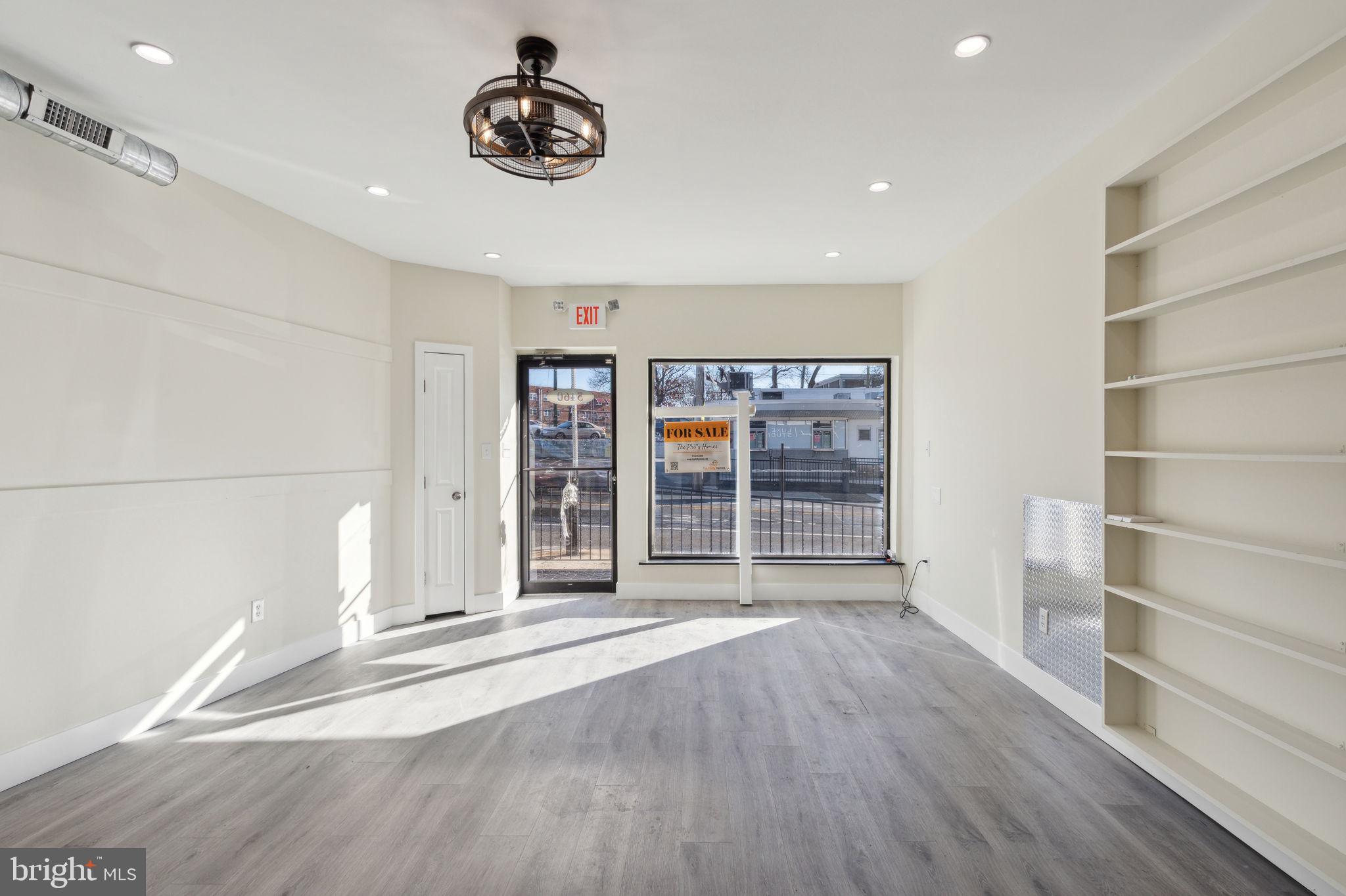 5460 Ridge Avenue Philadelphia, PA 19128 - Photo 13 of 26 a view of an empty room with a window and wooden floor
