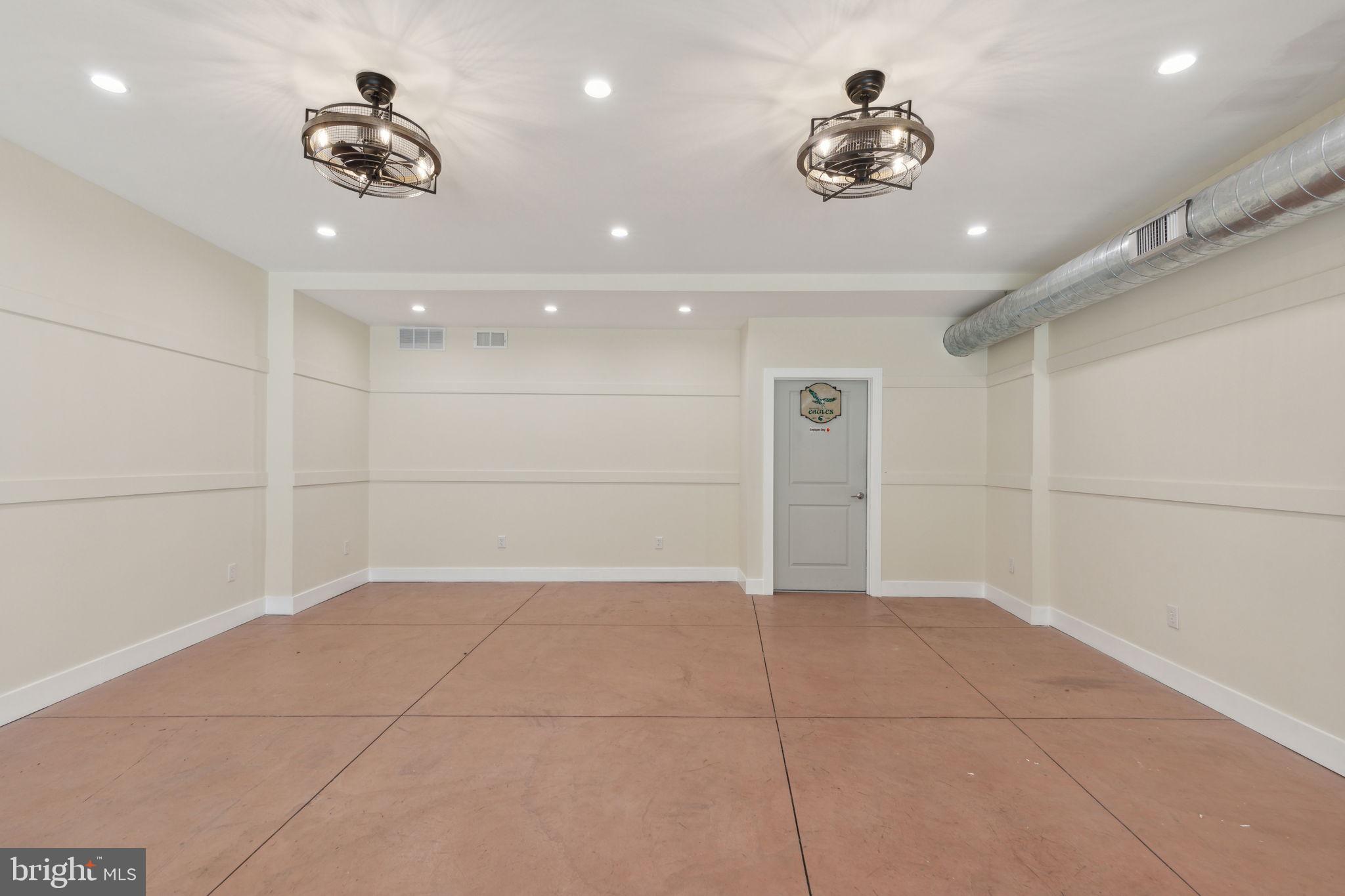 5460 Ridge Avenue Philadelphia, PA 19128 - Photo 16 of 26 a view of a livingroom with a ceiling fan and window