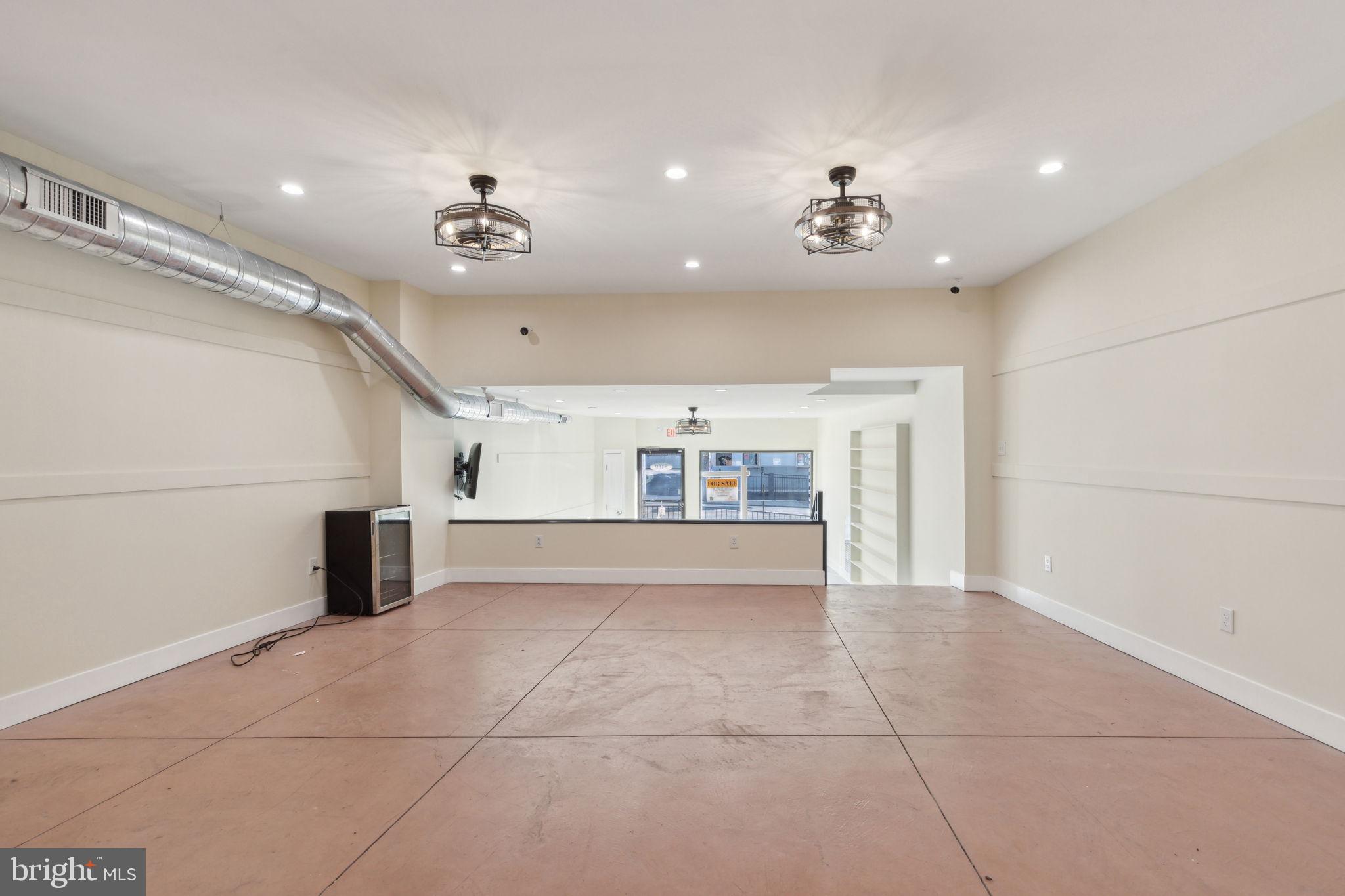 5460 Ridge Avenue Philadelphia, PA 19128 - Photo 19 of 26 wooden floor in an empty room with a window