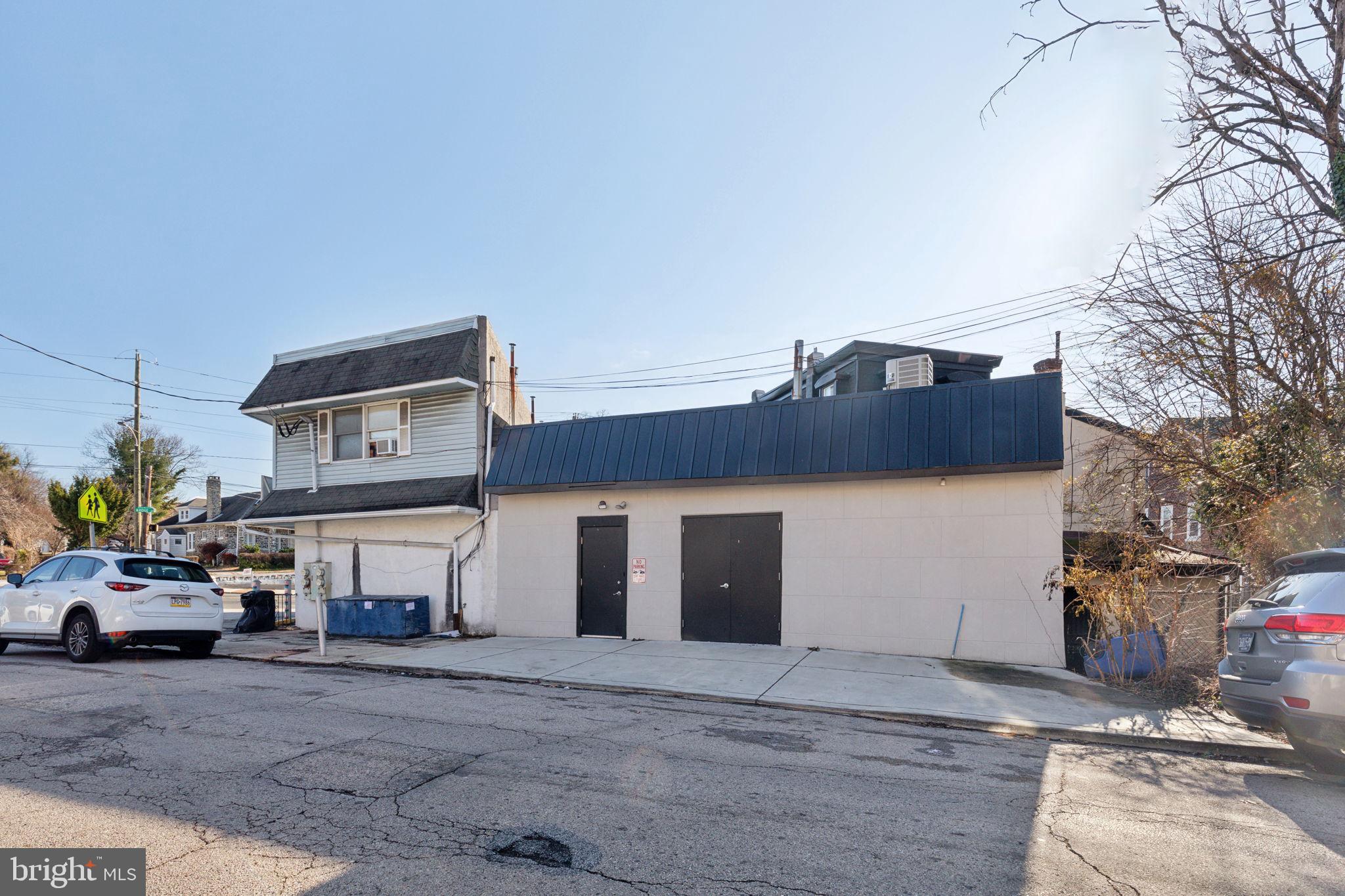 5460 Ridge Avenue Philadelphia, PA 19128 - Photo 7 of 26 a view of a car park in front of house